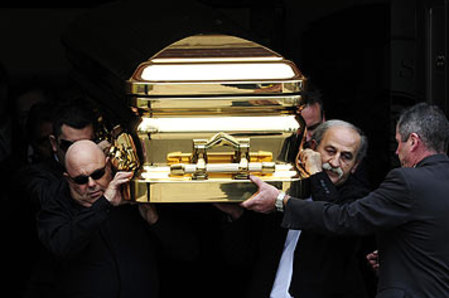 Pallbearers carry Carl Williams’ gold-plated coffin outside at St Therese’s church in Essendon. The funeral directors were never paid and the ornamental cross was stolen.