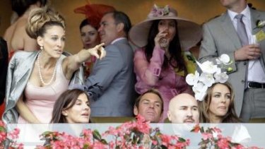 Sarah Jessica Parker (left) last visited Australia in 2011, when she watched the Oaks at Flemington alongside then couple Shane Warne and Elizabeth Hurley (right).
