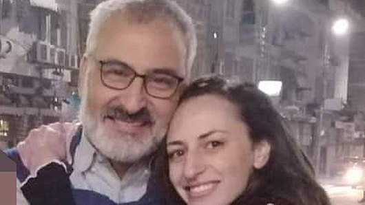 Hazem Hamouda with his daughter Saja when he was released from police custody.