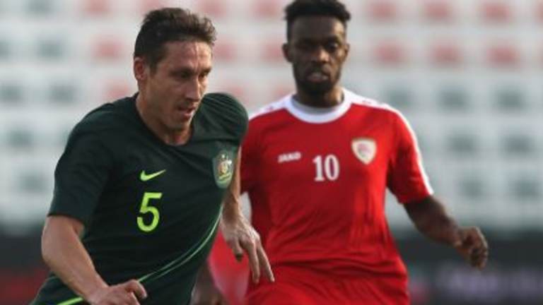 In control: Milligan in action against the underwhelming Oman in a warm-up friendly. 