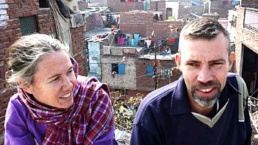 Mark and Cathy Delaney on the roof of their house in a Delhi slum in 2009
