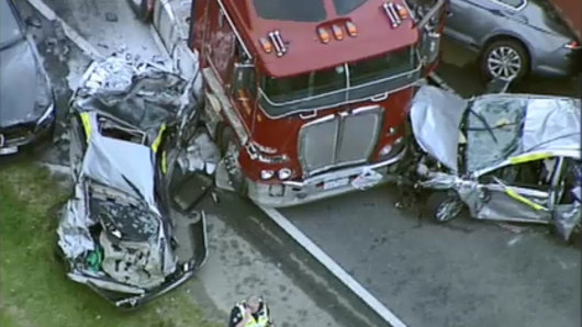 Cars were crushed between the trucks on the Monash Freeway, but miraculously no one was seriously injured.