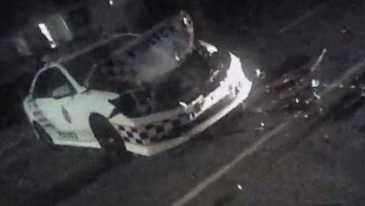 Police body-worn camera vision shows the officer's vehicle was extensively damaged.