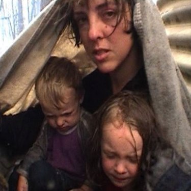 Bron, Lola and Dom Sparkes sheltering between the tanks after the worst of the fire had passed.