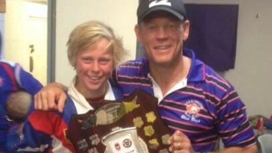 Tyran and Rod Wishart after winning the under-15 Group 7 grand final in 2014. Rod was Tyran’s coach.