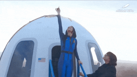 Katy Perry kisses the ground after all-female celebrity Blue Origin space flight.