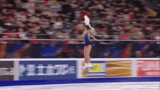 Sora imagery of an ice skater with a cat on her head.