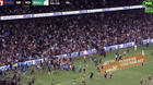 Fans rush the field as Alex Johnston breaks the NRL try-scoring record. 