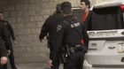Luigi Mangione, the suspected killer of UnitedHealthcare CEO Brian Thompson, exits a vehicle while in police custody.