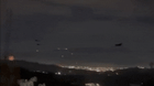 Helicopters are seen flying over Caracas after explosions rocked the city.