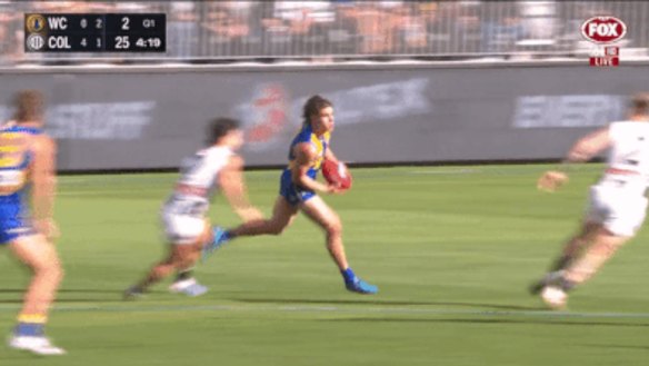 Jordan De Goey bumps Elijah Hewett.