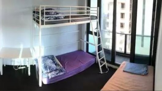 A bedroom with a bunk bed and single mattress currently being advertised on Gumtree. 