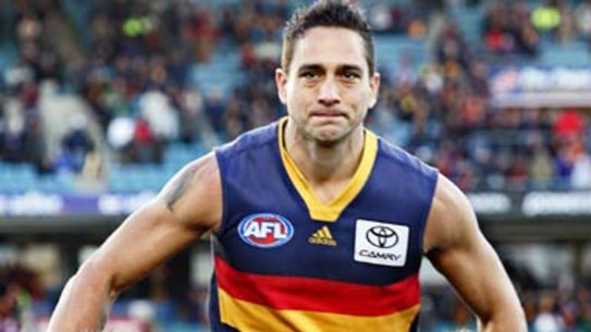 Andrew McLeod, pictured being chaired off the ground after his 300th game, now feels he's not welcome. 