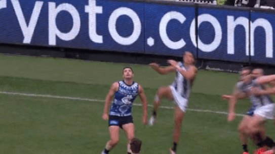 Ash Johnson flies high for the Pies against Carlton.