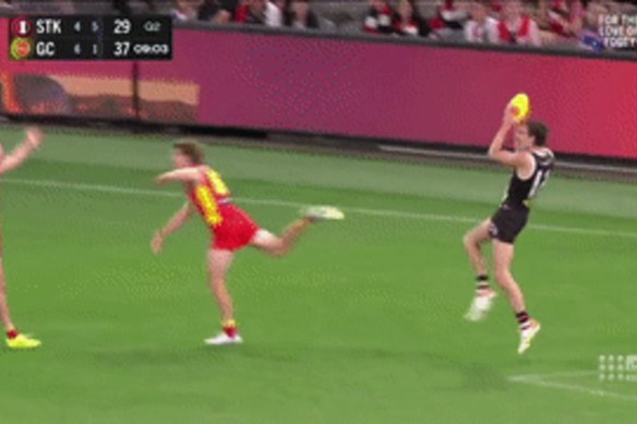 Dissent over decisions: Gold Coast players put their arms out over a call.