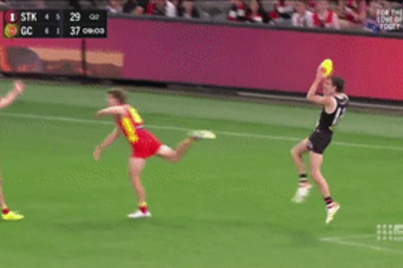 Dissent over decisions: Gold Coast players put their arms out over a call.