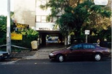 Outside the St Kilda motel after Richard Mladenich's murder