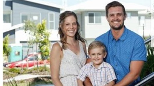 Aura's Ryan McIntyre and his family at the new residential estate at Caloundra South, where a future rail link will run.