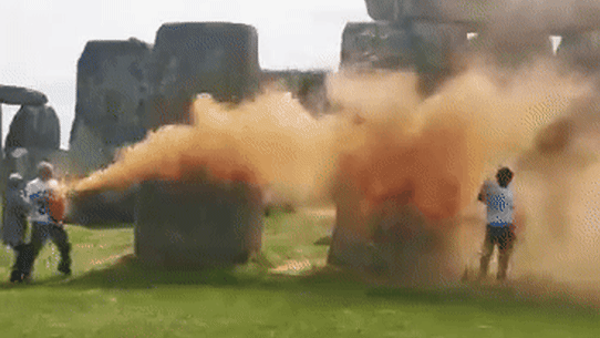 Climate protesters spray colour on Stonehenge.