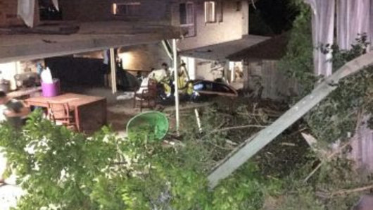 The car ploughed into the yards of two homes at Sumner in Brisbane's south-west overnight. 