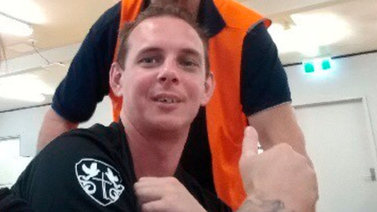 Released after 500 days in detention: Brendan Thoms with his parents Jenny and Robert.