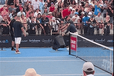 A snake catcher on court during Dominic Thiem’s match with James McCabe.