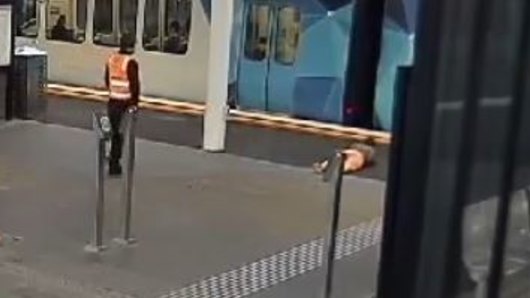An image from CCTV footage of the woman after she tripped and fell while rushing for a train.