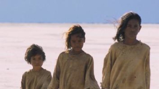 Great escape: Tianna Sansbury (left), Laura Monaghan and Everlyn Sampi walk across a dry salt lake in <i>Rabbit-Proof Fence</i>. 