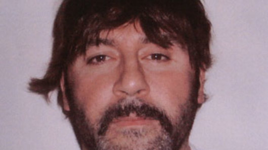 Tony Mokbel was arrested in Greece while wearing a famously ill-fitting hairpiece.