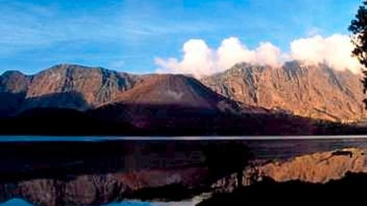 In calmer times: Mount Rinjani spews clouds of gas on Lombok island, east of Jakarta, Indonesia.  