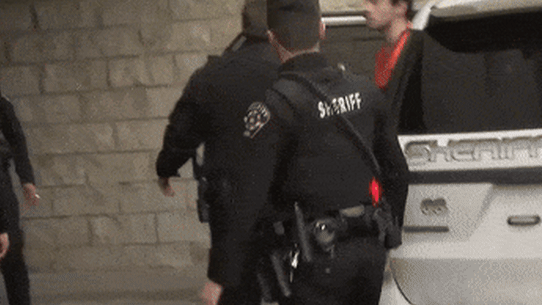 Luigi Mangione, the suspected killer of UnitedHealthcare CEO Brian Thompson, exits a vehicle while in police custody.