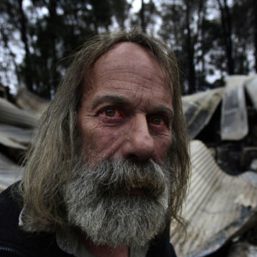 Rob Hallett in front of his stone shed in Narbethong which housed his antique motorcycle collection and gun collection.