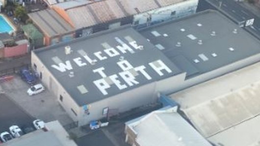 The “Welcome to Perth” sign on a rooftop in Sydenham, Sydney. 