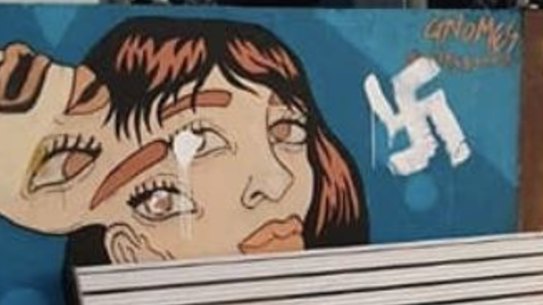 The defaced mural wall at Bondi Beach.