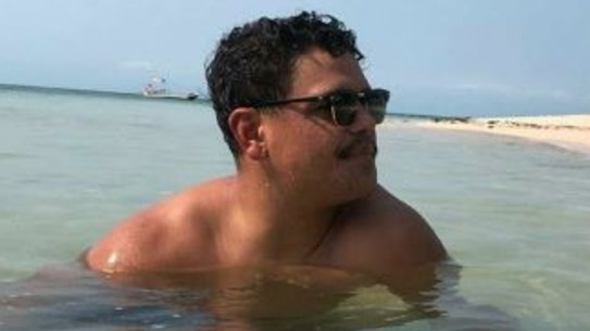 Latrell Mitchell relaxes on the Great Barrier Reef.