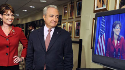 Sarah Palin stands next to producer Lorne Michaels during her appearance on Saturday Night Live in New York. He is the most awarded Emmy winner in history.