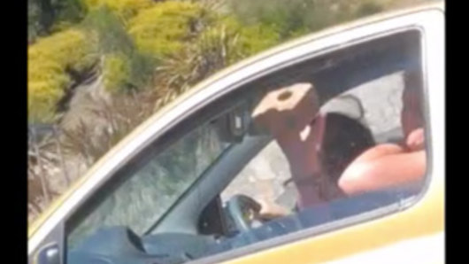 Police have arrested two women after a brick was thrown at a car on the Monash Freeway.