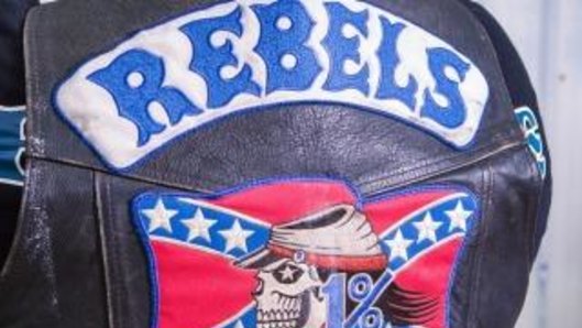 A Rebels member is among the four people charged.