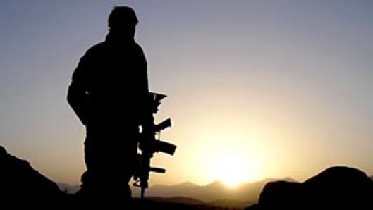 An Australian Special Operations Task Group soldier observing the valley during the Shah Wali Kot Offensive in Afghanistain in 2010.