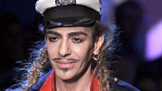 (FILES) A photo taken on October 1, 2010 in Paris shows British designer John Galliano during the French fashion house Christian Dior Spring/Summer 2011 ready-to-wear collection. Galliano was found guilty of anti-Semitic insults on September 8, 2011 and handed a suspended fine of 6.000 euros (8.400 US dollars) over a series of drunken outbursts in a Paris bar in February this year and October 2010. acknowledges the public . AFP PHOTO/FRANCOIS GUILLOT