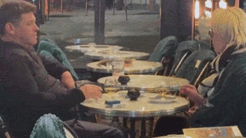 France in flames but cafe-loving Parisians carry on