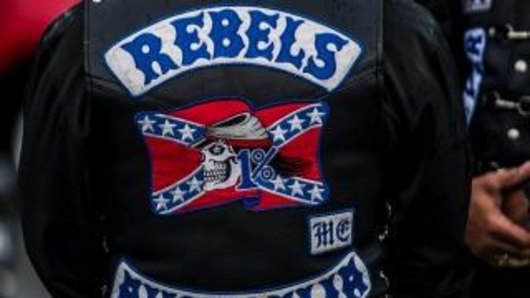 Four Rebels bikies are facing court over an assault on a fellow club member.