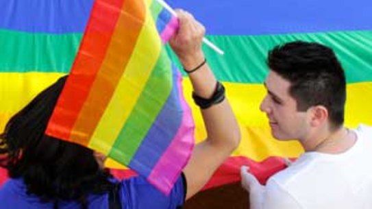 Protesters rally for gay marriage equality outside the Melbourne Town Hall.