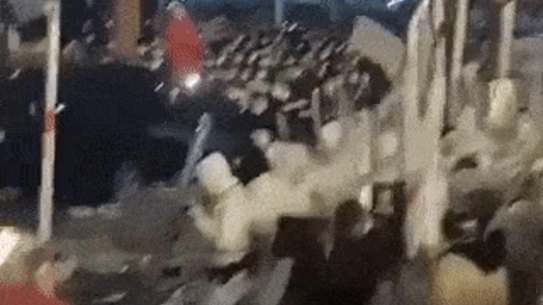 Workers in China clash with security personnel. 