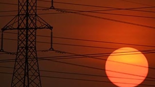 FAIRFAX GENERICS 23/01/07 - A generic photo of the sun setting behind high voltage powerlines , electricity , solar , power , global warming alternative energy , fossil fuel   Pic Glenn Campbell