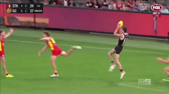 Dissent over decisions: Gold Coast players put their arms out over a call.