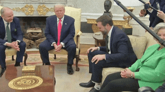 Trump admires Vance’s socks in the Oval Office.