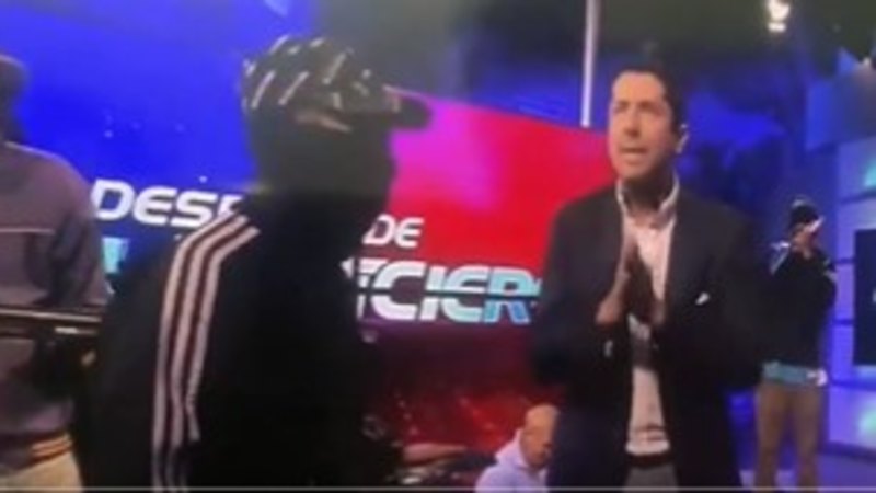 Ecuador TV studio stormed live on air by masked people brandishing guns