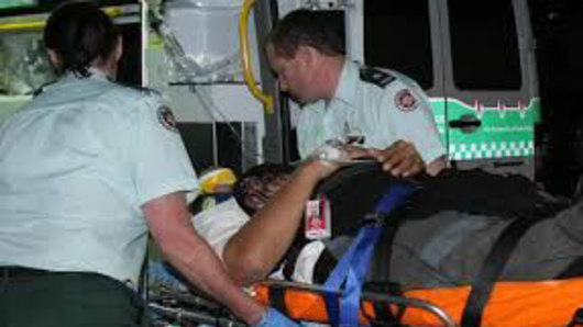 Fuzzy Maiava on a stretcher after he was badly injured on Qantas Flight 72 in 2008.