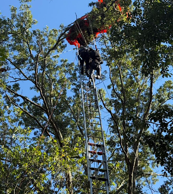 The student’s reserve parachute deployed, saving his life.